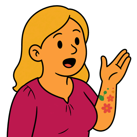 A blonde woman wearing a pink shirt with floral tattoos on her arm holds her hand up speaking.