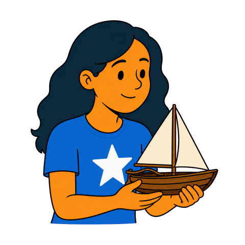A woman in a blue star T-shirt holding a small wooden sailboat.
