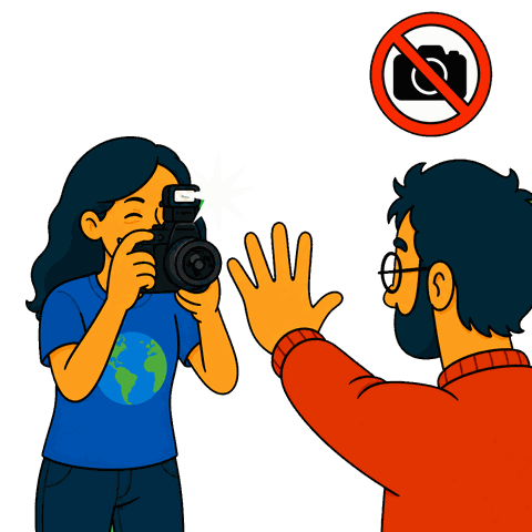 A woman holds a camera with flash while a man holds his hand up, below a crossed-out camera icon.